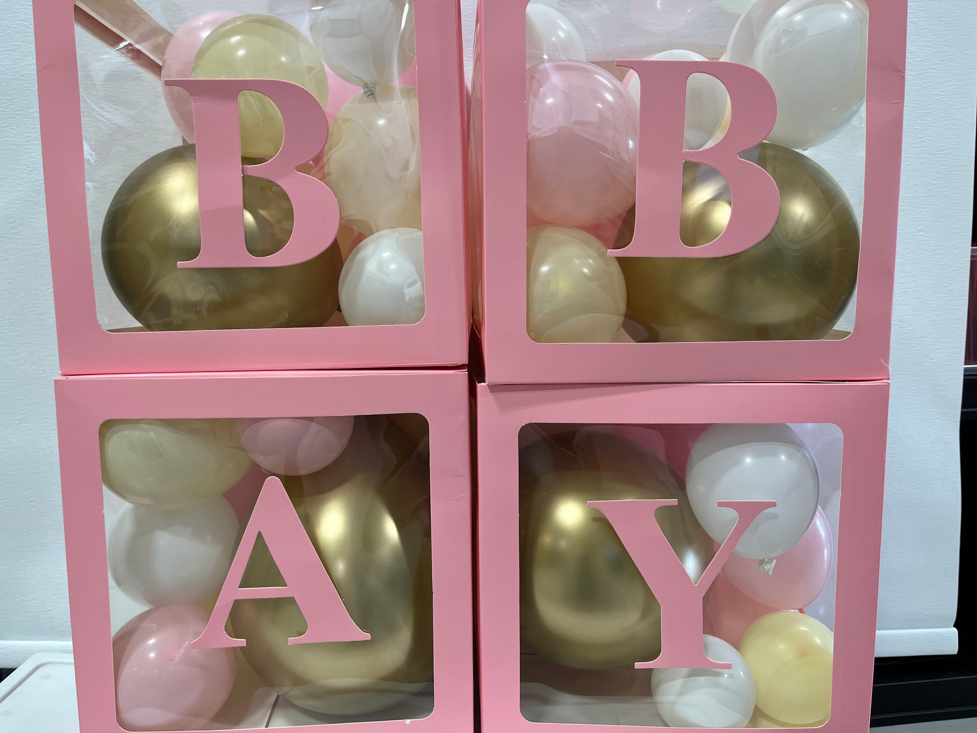 Pink baby balloon boxes with letters